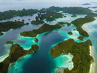 Aerial view of many small tropical islands with turquoise water and exposed reefs, Pulau Wayag, Raja Ampat, West Papua, Indonesia [IBR124899559]