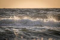 Surf, breaking wave against light, Sortebærdalen Strand, Houvig, North Sea, Denmark [IBR124899877]