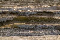 Surf, breaking waves with spray against light, Sortebærdalen Strand, Houvig, North Sea, Denmark [IBR124899880]