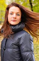 Pretty woman is shaking her hair and looking at camera [IBR124906341]