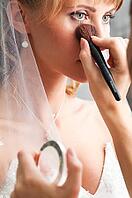 Bride is doing make up for wedding celebration [IBR124906372]