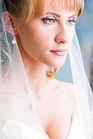 Beautiful bride is standing in wedding dress [IBR124906374]