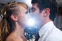 Just married couple is kissing at wedding celebration party [IBR124906375]