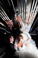 Bride and groom at limo with mirror ceiling [IBR124906381]