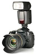 Photo camera with an external flash attached [IBR124906400]