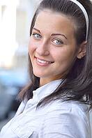 Closeup portrait of a woman at sunny street [IBR124906420]