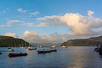 View of a bay with boats, near Portree in summer 2018 [IBR124915236]