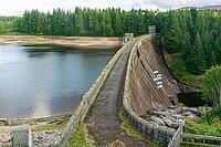View from the lakeshore near the dam wall against a cloudy sky, near Aberchalda in summer 2018 [IBR124915243]