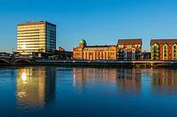 View over the river against buildings in evening sun, Newport in summer 2018 [IBR124915246]