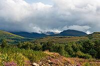 View of the Scottish Highlands, green meadows and cloudy skies in summer 2018 [IBR124915247]