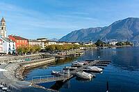 View of buildings on the lakeside against mountains [IBR124915251]