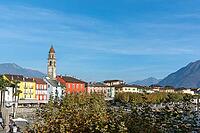 View of buildings on the lakeside against mountains [IBR124915257]