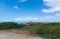 View of an old building on the Atlantic coast under a slightly cloudy sky, near Setubal in spring 2019 [IBR124915265]
