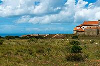 View of an old building on the Atlantic coast under a slightly cloudy sky, near Setubal in spring 2019 [IBR124915267]