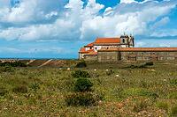 View of an old building on the Atlantic coast under a slightly cloudy sky, near Setubal in spring 2019 [IBR124915268]