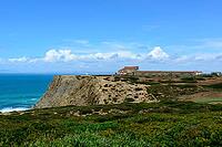 View of a rocky coast by the sea under a slightly cloudy sky, near Setubal in spring 2019 [IBR124915270]