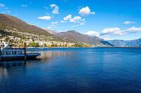 View of boats on a lake with mountains in the background [IBR124915281]