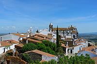 View from above over the rooftops of the city against a slightly cloudy sky, Monsaraz in spring 2019 [IBR124915285]