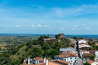View from above over the rooftops of the city against a slightly cloudy sky, Monsaraz in spring 2019 [IBR124915287]