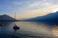 View of boats on the lake against sunset [IBR124915289]