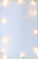 Christmas lights on gray table, view from above [IBR124944035]