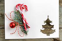 Cut paper in fir-tree shape with decoration for christmas card or new year background on wooden table [IBR124944043]