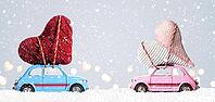 Couple of retro toy cars delivering craft hearts for Valentine's day on gray background with flying cars [IBR124944052]