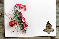 Cut paper in christmas tree shape with decoration for christmas card or new year background on wooden table [IBR124944058]