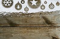 Christmas card or new year background made of xmas symbols handwritten on snow and wooden table [IBR124944066]
