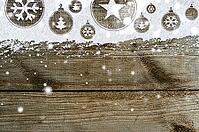 Christmas card or new year background made of xmas symbols handwritten on snow and wooden table [IBR124944085]