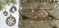 Christmas card or new year background made of xmas symbols handwritten on snow with fir-tree branches and wooden table [IBR124944089]