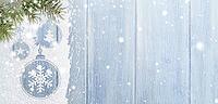 Christmas card or new year background made of xmas symbols handwritten on snow with fir-tree branches and blue wooden table [IBR124944094]