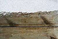 Christmas card or new year background made of snow and wooden table [IBR124944095]