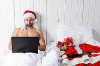 Santa Claus in hotel room without costume shopping for Christmas or New Year [IBR124944121]