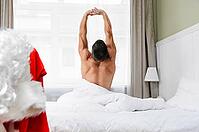 Santa Claus in hotel room without costume getting ready for Christmas or New Year [IBR124944122]