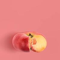 Fresh saturn peach on pink background, view from above [IBR124944128]
