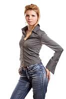 Blonde long-haired girl in shirt and jeans on white background [IBR124968386]