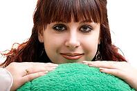 Portrait of brown-haired girl with her lovely toy on white background [IBR124968387]