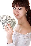 Young brown-haired woman thinking how to spend her money [IBR124968389]