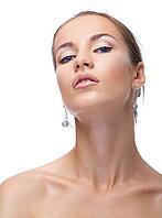 Close-up portrait of beautiful blue eyed caucasian model on white [IBR124968391]