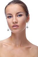 Close-up portrait of beautiful blue eyed caucasian model on white [IBR124968392]