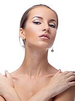 Close-up portrait of beautiful blue eyed caucasian model on white [IBR124968393]