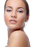 Close-up portrait of beautiful blue eyed caucasian model on white [IBR124968397]