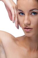 Close-up portrait of beautiful blue eyed caucasian model on white [IBR124968403]