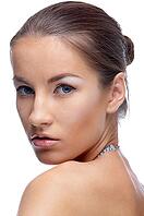Close-up portrait of beautiful blue eyed caucasian model on white [IBR124968405]