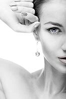 Close-up portrait of beautiful blue eyed caucasian model on white [IBR124968411]
