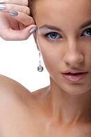 Close-up portrait of beautiful blue eyed caucasian model on white [IBR124968414]