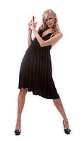 Portrait of beautiful blonde model poses in black dress [IBR124968425]