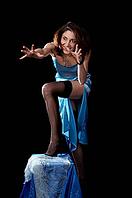 Woman in blue peignoir and tights isolated on the black background [IBR124968440]