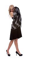 Portrait of beautiful blonde model poses in black dress with shawl [IBR124968447]